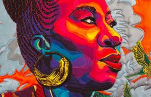 Colorful quilted portrait of activist Tarana Burke