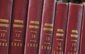 Photograph of journal bindings in an anthropology library, showing the transition where Eugenics Quarterly was renamed to Social Biology in 1969.