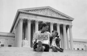 Nettie Hunt and her daughter Nickie sit on the steps of the U.S. Supreme Court.