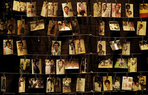  Family photographs of some of those who died hang on display in an exhibition at the Kigali Genocide Memorial centre in the capital Kigali, Rwanda Friday, April 5, 2019.