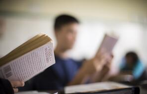 Students in classroom reading books