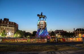 Image of the late Rep. John Lewis projected onto the Robert E. Lee statue in Richmond, Virginia.