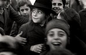 Several Jewish schoolchildren jostle each other. Taken circa 1935-1938.