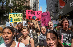 Demonstrators take part in a climate change march.