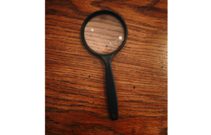 A black-framed magnifying glass