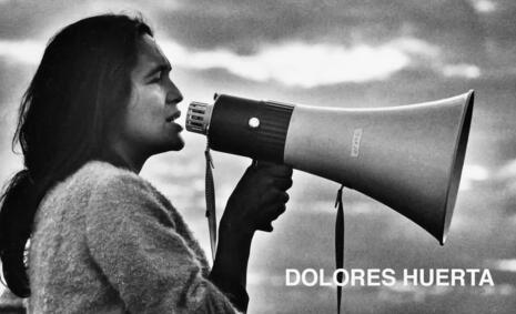 Dolores Huerta speaks through a megaphone.