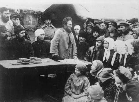 A communist agitator speaks to Russian peasants. 