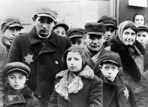  Jews wearing Star of David badges in the Lódz ghetto. Established in 1940, the Germans crowded 160,000 Jews from the Polish city, more than a third of its population, into the ghetto.