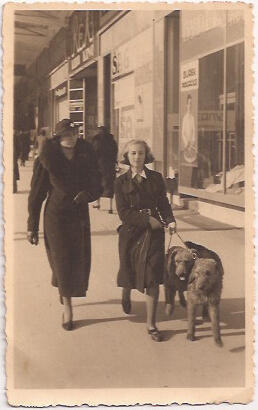 Holocaust survivor, Ava Kadishson Schieber, walks dogs next to her mother.