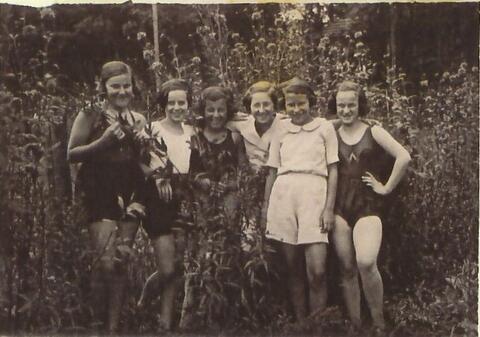 Image of Mark Finder's Sister, Stefanie, and their Friends in a field. 