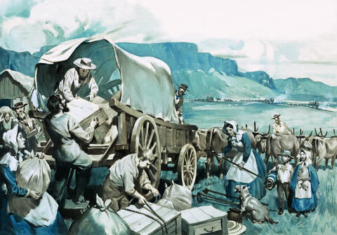 A caravan of covered wagons and oxen with men, women, and children loading supplies onto a wagon
