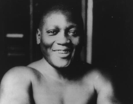Portrait photo of boxing champion Jack Johnson in b&w