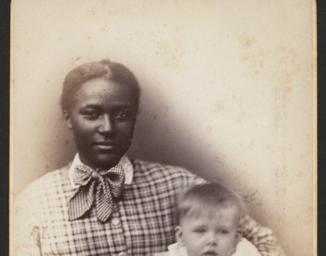 Young African American woman holding a baby