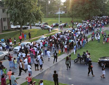 Peaceful demonstrators gather in Ferguson, Missouri, in the aftermath of Michael Brown’s death.
